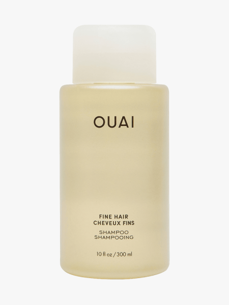 OUAI Fine Hair Shampoo in branded bottle component on a light gray background